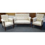 AN ANTIQUE THREE PIECE MAHOGANY FRAMED SUITE in multi-coloured flecked upholstery and with button