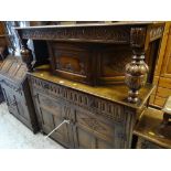 VINTAGE OAK COURT CUPBOARD with carved decoration, with two drawers and a two cupboard base,