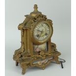 FRENCH TWO TRAIN GILT METAL MANTEL CLOCK decorated with porcelain panels, with key together with