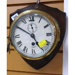 BRASS PORTHOLE STYLE WALL CLOCK mounted on a wooden shield back by Smiths Astral