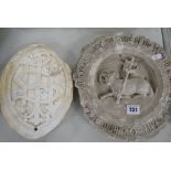 TWO VICTORIAN PLASTER MAQUETTES, an oval carved IHS, together with a roundel of a lamb holding a
