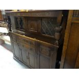 VINTAGE OAK OLD CHARM STYLE COURT CUPBOARD with carved decoration and centre cupboard flanked by
