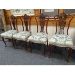 A SET OF FOUR EDWARDIAN CARVED LYRE BACK DRAWING ROOM CHAIRS