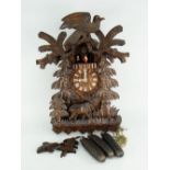 BLACK FOREST CARVED CUCKOO CLOCK featuring stag and rotating figures, complete with original