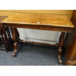 VICTORIAN WALNUT FOLDOVER CARD TABLE having base lined interior and on carved lyre supports with