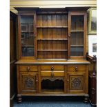 EARLY 20TH CENTURY OAK CARVED DRESSER with semi-glazed open rack and a base with carved cupboards
