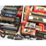 BOXED & LOOSE OO GAUGE RAILWAY CARRIAGES & LOCOMOTIVES including Hornby, Mainline (many in 'barn'