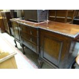 ANTIQUE MAHOGANY SIDEBOARD having three centre drawers, flanking cupboards, ball and claw supports