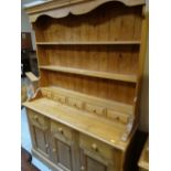 PINE DRESSER having open rack with spice drawers, cupboard and drawers to the base, 198cms h x