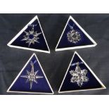 FOUR BOXED SWAROVSKI CRYSTAL LIMITED EDITION CHRISTMAS SNOWFLAKE ORNAMENTS (1994-1997)