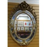 IMPRESSIVE REPRODUCTION ROCOCO STYLE OVAL WALL MIRROR with elaborate floral and scroll work finial