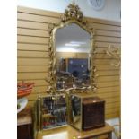 REPRODUCTION ROCOCO-STYLE FLORAL GILT FRAMED MIRROR and a gilt metal three pane toilet mirror