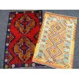 TWO RUGS comprising blue and red ground geometric Baluchi rug, 138 x 89cms and an orange and brown