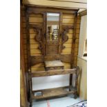 A VINTAGE CARVED MIRROR BACK HALL STAND