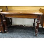 VICTORIAN MAHOGANY SIDE-TABLE of rounded rectangular form and with caved supports and stretchers