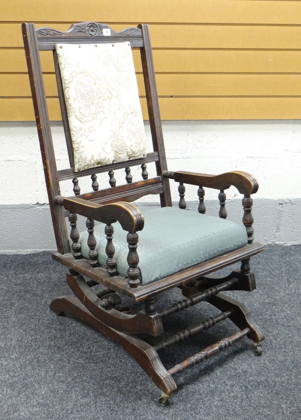 VINTAGE CARVED AMERICAN TYPE ROCKING CHAIR with padded seat and back