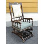 VINTAGE CARVED AMERICAN TYPE ROCKING CHAIR with padded seat and back