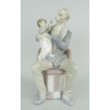 LLADRO PORCELAIN MODEL OF A MOUSTACHED GRANDFATHER & INFANT ON HIS LAP seated on a pink chair