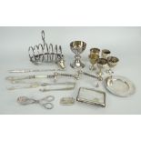 ASSORTED EPNS to include six section toast rack, egg cups, knife rests, cigarette case, sugar nips