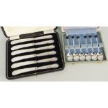 CASED SET OF SIX SILVER HANDLED BUTTER KNIVES and cased set of six coffee bean spoons