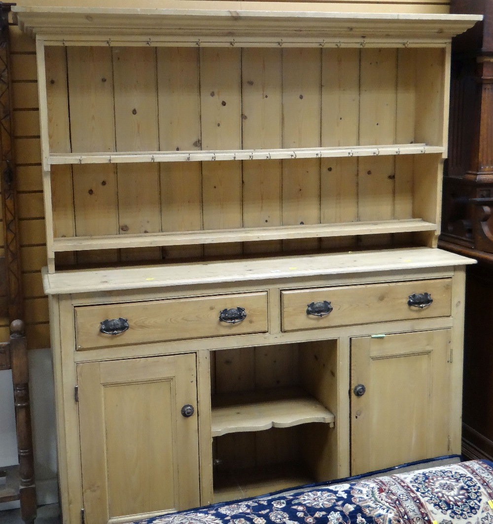 PINE DRESSER having two drawers, two cupboards, centre recess, 157cms wide