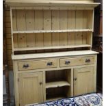 PINE DRESSER having two drawers, two cupboards, centre recess, 157cms wide