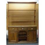GOOD EARLY 20TH CENTURY PINE WELSH DRESSER, flanking cupboard base, three drawers and centre shelved