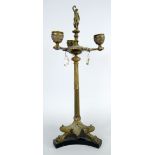 19TH CENTURY GILT METAL THREE BRANCH TABLE CANDELABRA in classical form with triform base, claw feet
