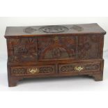 AN INTERESTING 19TH CENTURY WELSH OAK CARVED COFFER CHEST on bracket feet with two base drawers