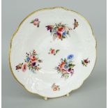 NANTGARW PORCELAIN SOUP DISH of alternate lobed form, the border moulded with ribbons, flowers and