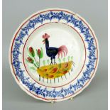 LLANELLY COCKEREL PLATE typically decorated with sponged leaves to the border, 24.5cms diam