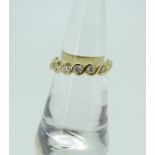 18CT YELLOW GOLD FIVE STONE DIAMOND WAVE DESIGN RING, 3.7 grams. Condition Report: Good overall