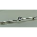 WHITE METAL SINGLE STONE DIAMOND BAR BROOCH the diamond measuring 0.5cts approximately in T. W. Long