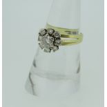 18CT YELLOW GOLD DIAMOND FLOWER CLUSTER RING, the central stone (approximately 0.40ct), surrounded