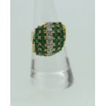 18CT YELLOW GOLD DIAMOND AND EMERALD FIVE ROW RING, the seven diamonds approximately 0.5cts overall,