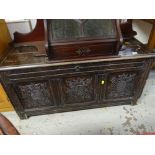 ANTIQUE OAK THREE PANELED COFFER with carved decoration
