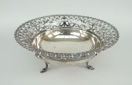 SILVER FOOTED BOWL of flared form, open-work border, raised over three scrolling feet, Sheffield