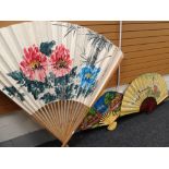 THREE ORNAMENTAL ORIENTAL-STYLE FURNISHING FANS including very large floral painted bamboo fan,