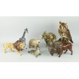 SEVEN ASSORTED CERAMIC WILD ANIMAL SCULPTURES including Beswick prowling lion, Beswick seal, owl,