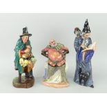 THREE ROYAL DOULTON BONE CHINA FIGURES to include 'The Mask Seller' HN2103, 'The Wizard' HN2877