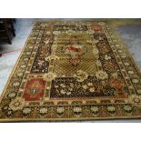 MAINLY GOLD & BLACK GROUND PERSIAN STYLE RUG with centre decoration and urn and flower decorated