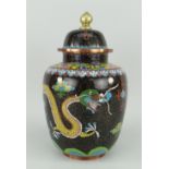 LIDDED CLOISONNE VASE, black ground gilded and with circling dragon and floral border