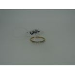SEVEN STONE DIAMOND RING set in 9ct yellow gold, with gem certificate in box, 2.2gms