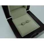 PAIR OF YELLOW METAL DIAMOND EARRINGS with gem specification card, in box