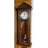 EDWARDIAN MAHOGANY & EBONIZED WALL CLOCK with circular dial and bearing Roman numerals