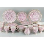 FISCHER & MIEG PORCELAIN PART TEA SET, approximately 32 pieces, plates with ribbon borders, pink