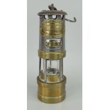 E. THOMAS & WILLIAMS LIMITED ABERDARE MINER'S LAMP, small version with brass base, white metal body,