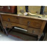 BARLEY TWIST SIDE-TABLE with tooled leather top and three drawers, 107cms wide x 84cms high