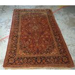 MAINLY RED & BLUE GROUND PERSIAN WOOLEN RUG with centre medallion decoration and with a border, mai