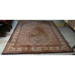 LARGE MAINLY BLUE GROUND PERSIAN WOOLEN RUG with repeating central pattern and contrasting border (